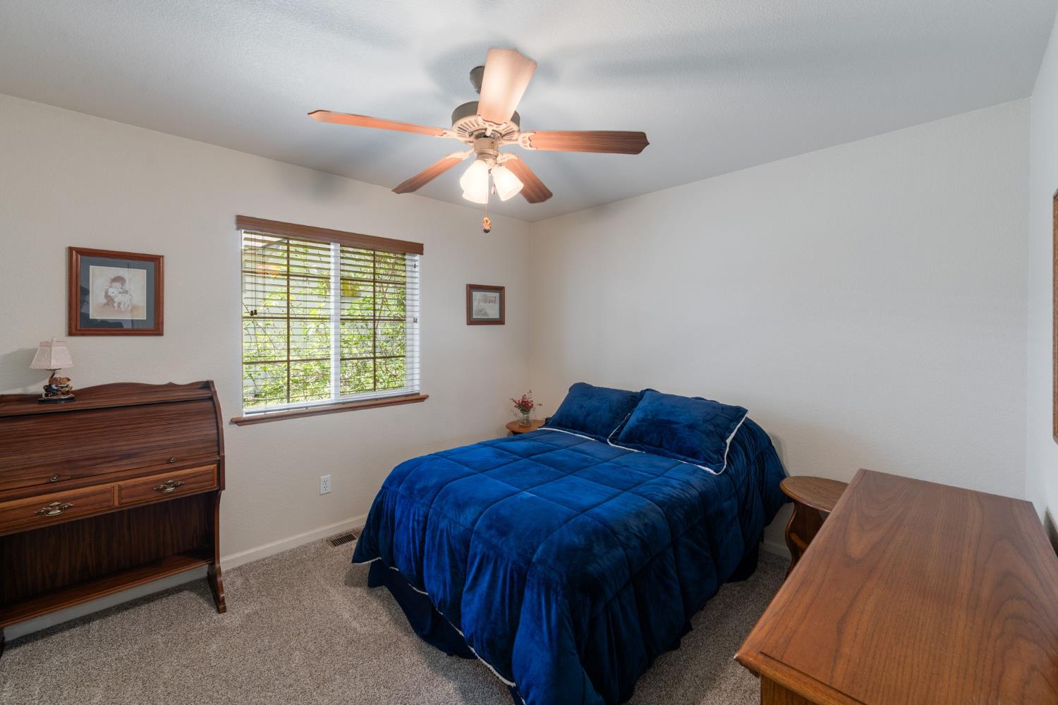 6221 Speckled Road Pollock Pines, CA 95726 - Photo 21 of 41 a bedroom with a bed and a window