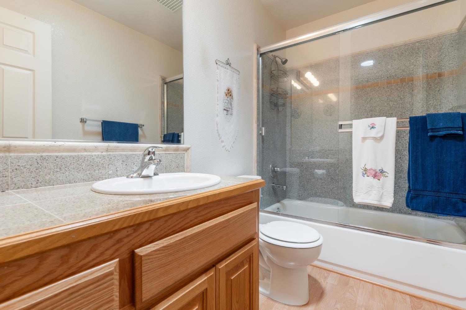 6221 Speckled Road Pollock Pines, CA 95726 - Photo 23 of 41 a bathroom with a sink toilet and shower