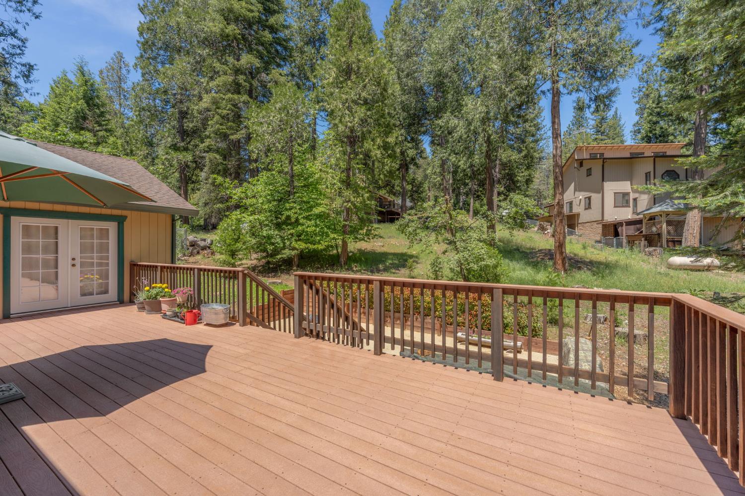 6221 Speckled Road Pollock Pines, CA 95726 - Photo 35 of 41 a view of a deck with wooden floor and fence