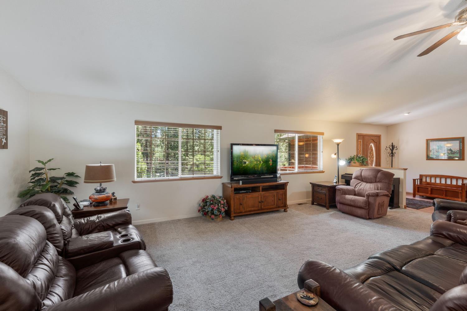 6221 Speckled Road Pollock Pines, CA 95726 - Photo 4 of 41 a living room with furniture and a flat screen tv