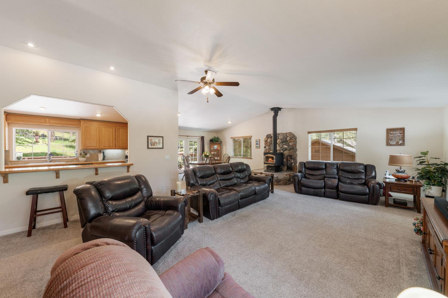 6221 Speckled Road Pollock Pines, CA 95726 - Photo 7 of 41 a living room with furniture ceiling fan and a window