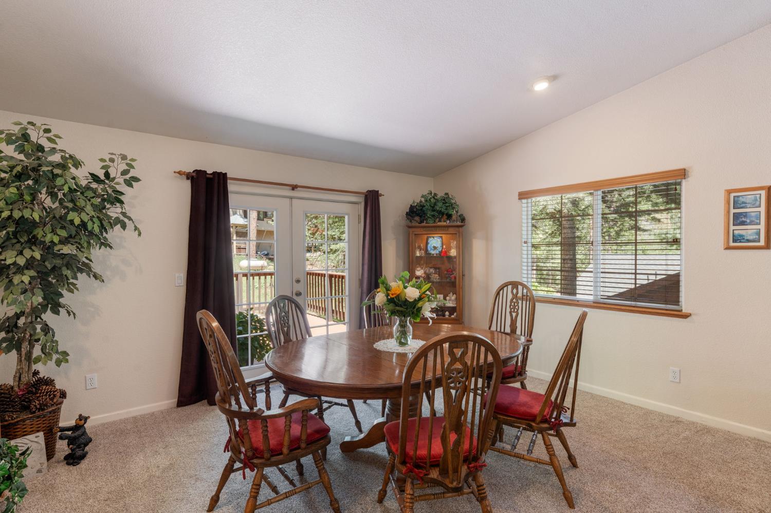 6221 Speckled Road Pollock Pines, CA 95726 - Photo 8 of 41 a view of a dining room with furniture window and outside view