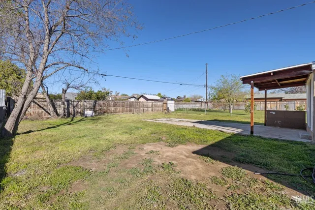 a view of yard with swimming pool
