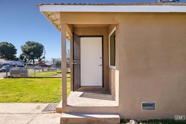 a view of a swimming pool with outdoor seating