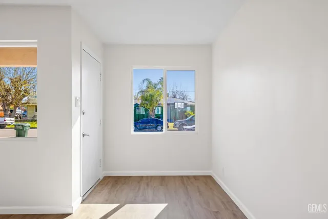 a view of an entryway with wooden floor