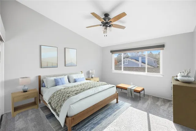 an empty room with a window and a ceiling fan