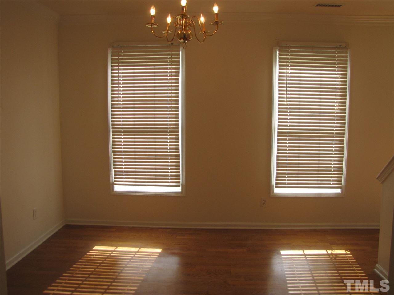 2309 Folger Street Raleigh, NC 27604 - Photo 3 of 23 a view of an empty room with wooden floor and a window