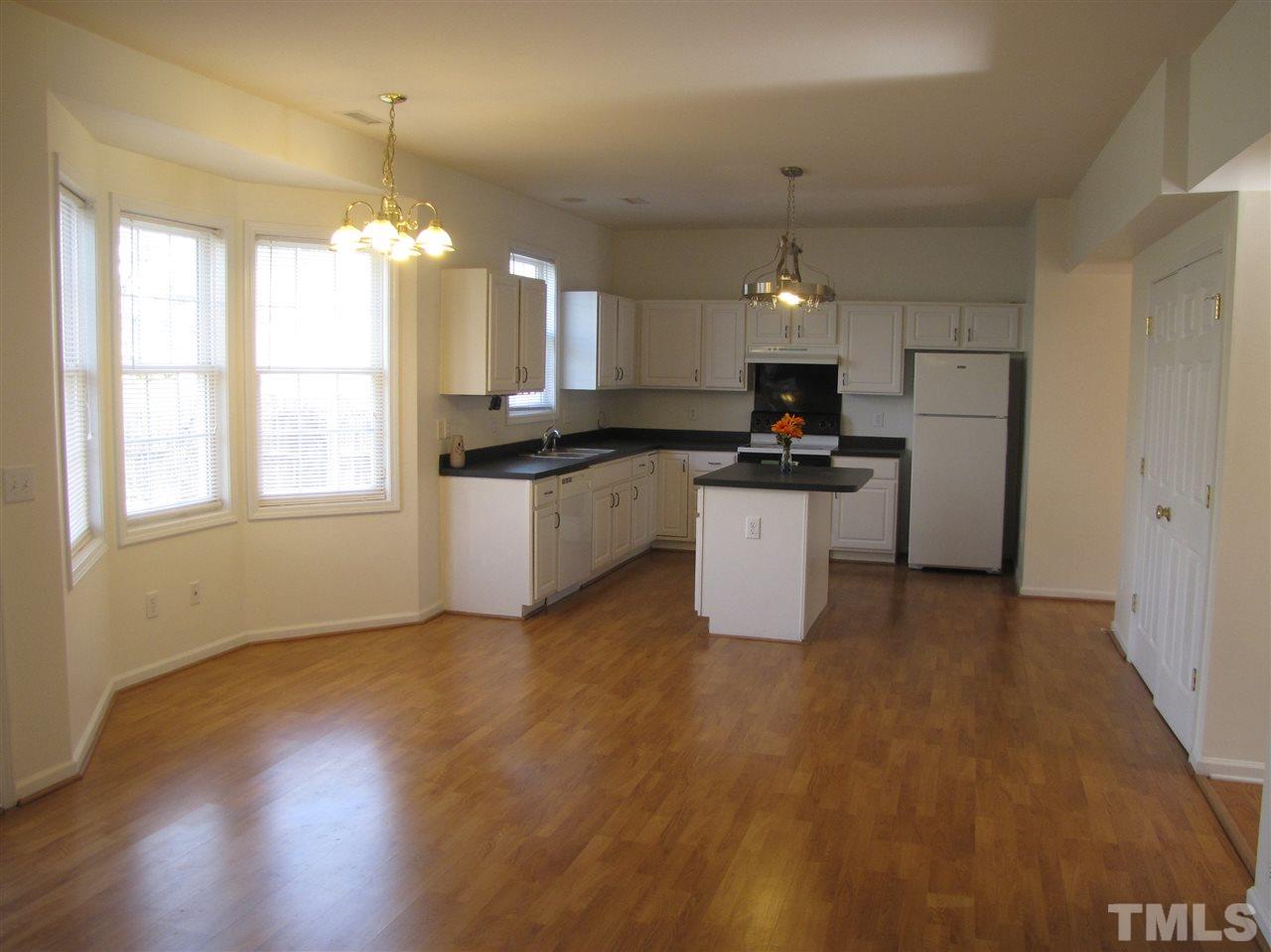 2309 Folger Street Raleigh, NC 27604 - Photo 5 of 23 a kitchen with granite countertop a stove and a sink