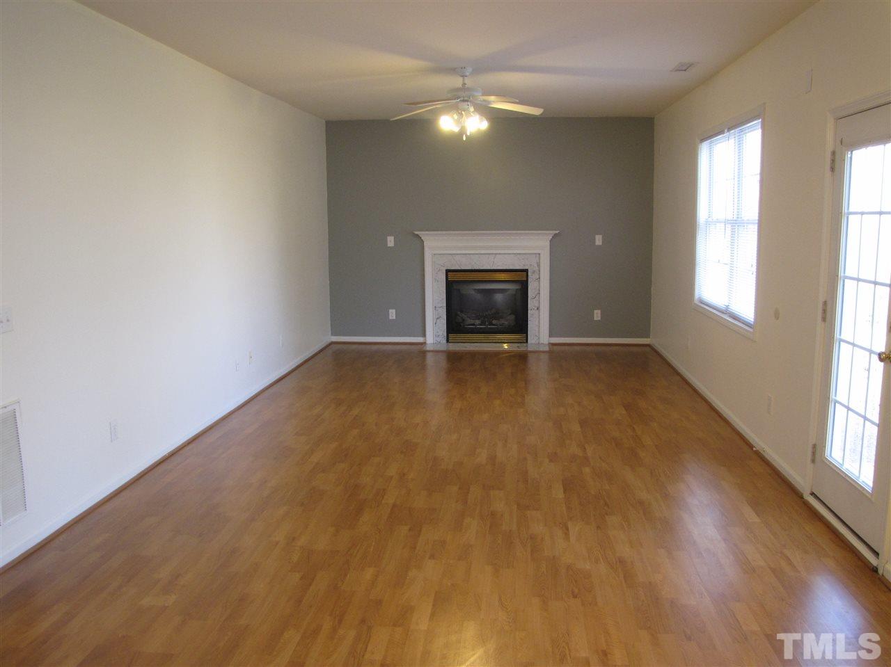 2309 Folger Street Raleigh, NC 27604 - Photo 7 of 23 an empty room with windows and fireplace
