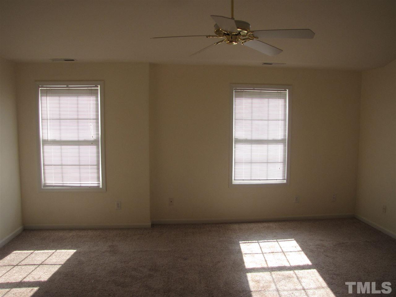 2309 Folger Street Raleigh, NC 27604 - Photo 10 of 23 an empty room with windows and fan