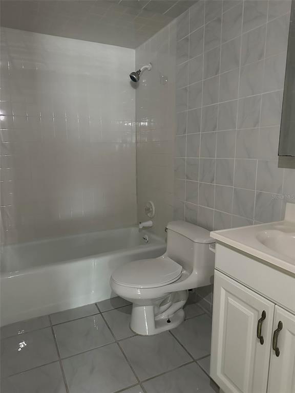 525 South Conway Road, Unit 109 Orlando, FL 32807 - Photo 11 of 18 a bathroom with a sink a toilet and shower