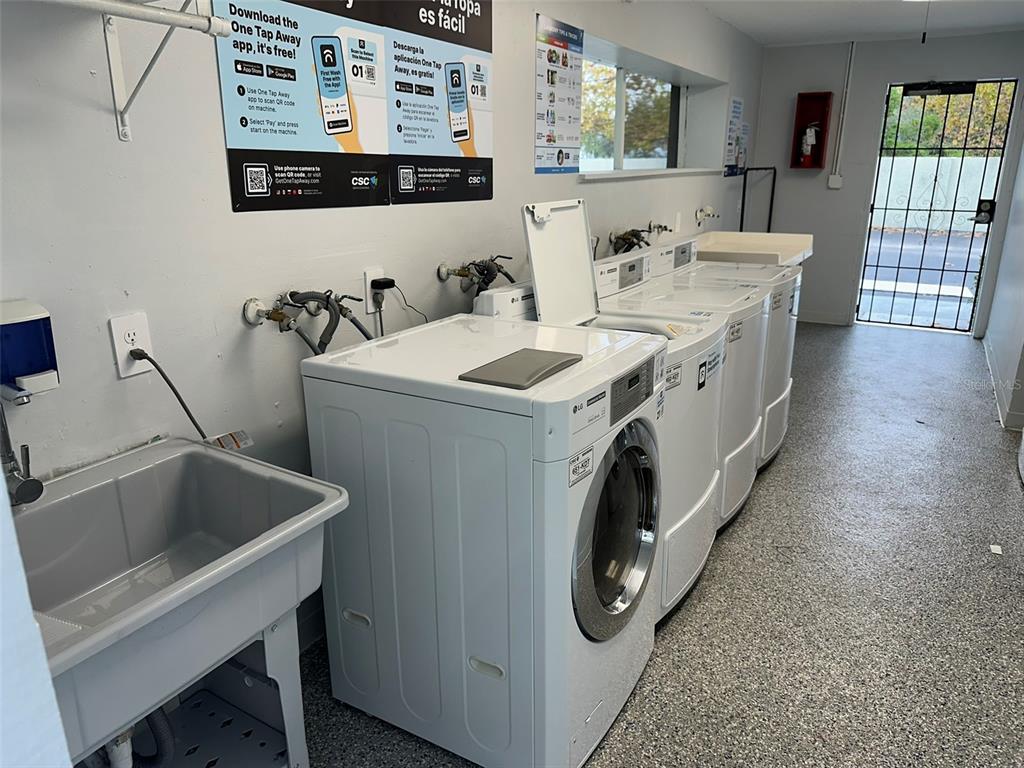 525 South Conway Road, Unit 109 Orlando, FL 32807 - Photo 14 of 18 a utility room with dryer and washer