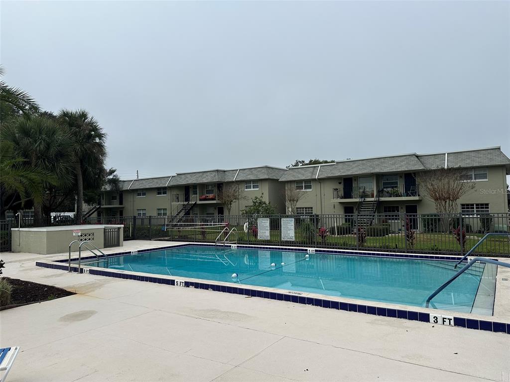525 South Conway Road, Unit 109 Orlando, FL 32807 - Photo 17 of 18 a view of house with yard