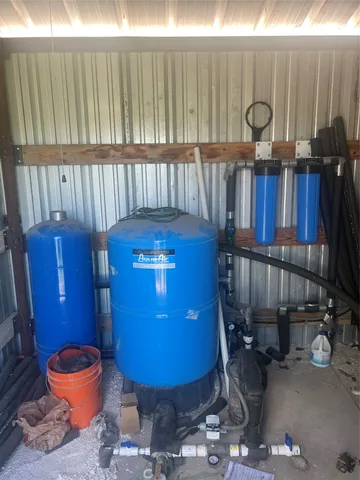 a view of a room with a table and chairs