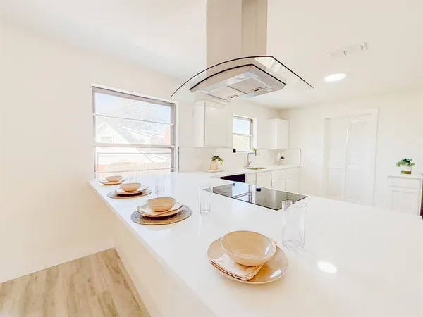 a kitchen with stainless steel appliances a sink and a stove