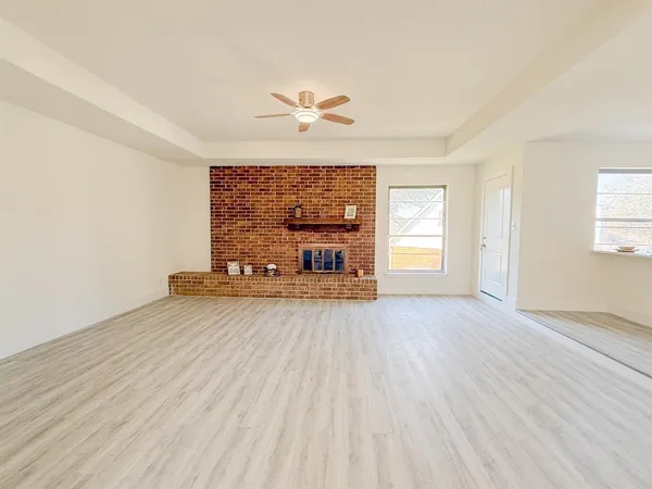 a view of a livingroom with a furniture and wooden floor