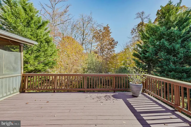 a view of deck with wooden floor and outdoor seating