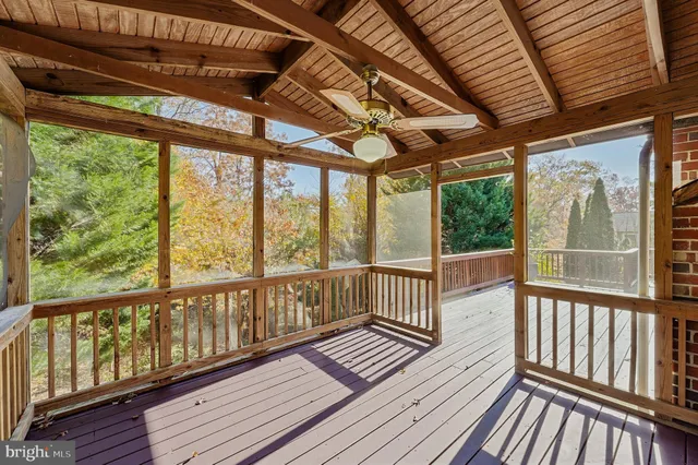 a view of a balcony with wooden floor