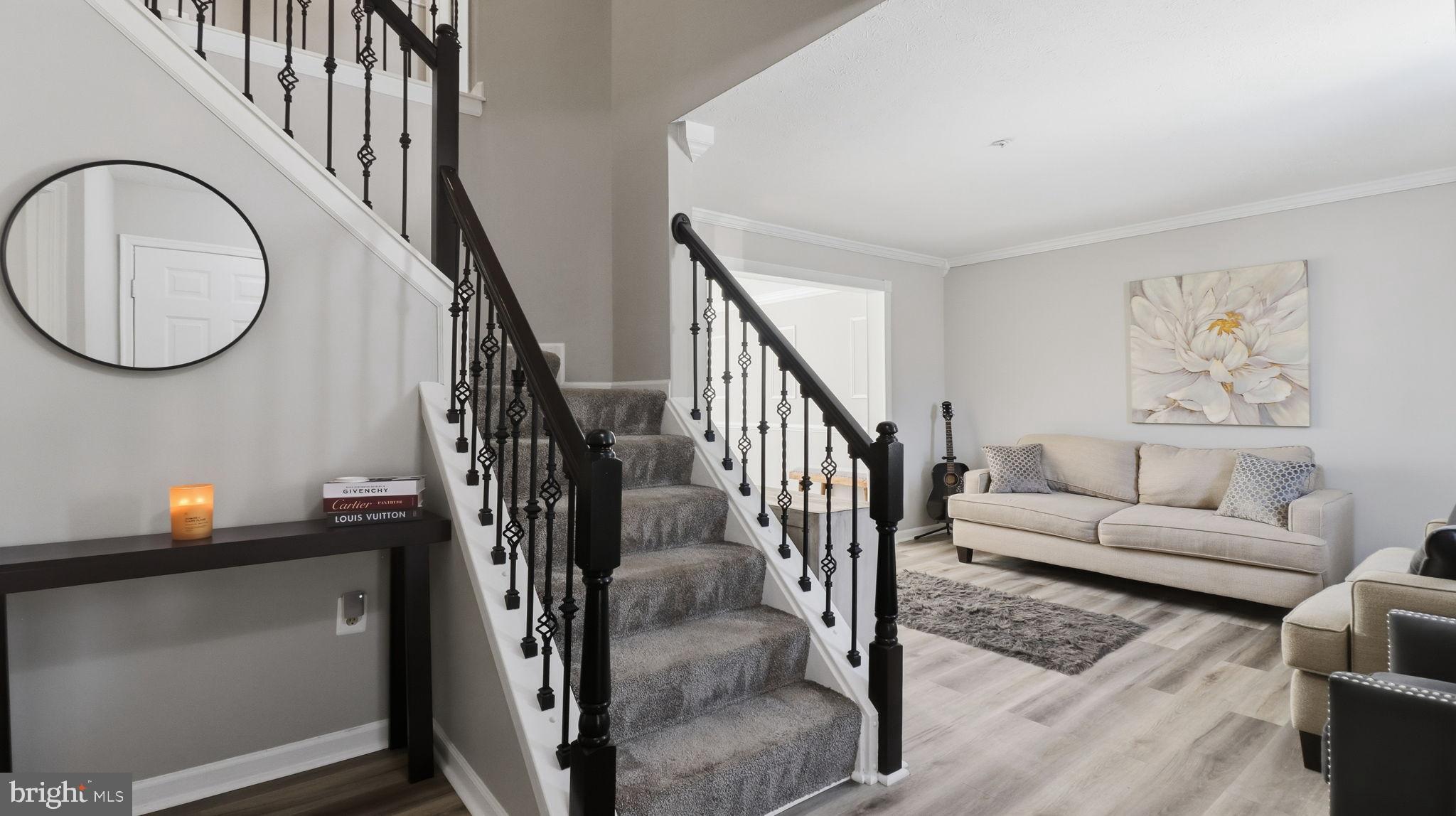 7105 Friendship Road Clinton, MD 20735 - Photo 41 of 90 Elegant entryway with stylish staircase.