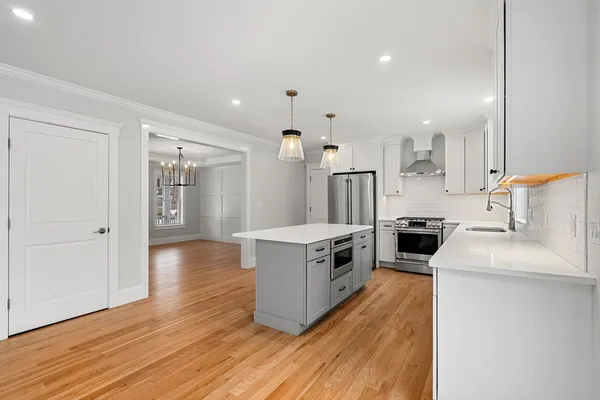 a kitchen with a stove and a refrigerator