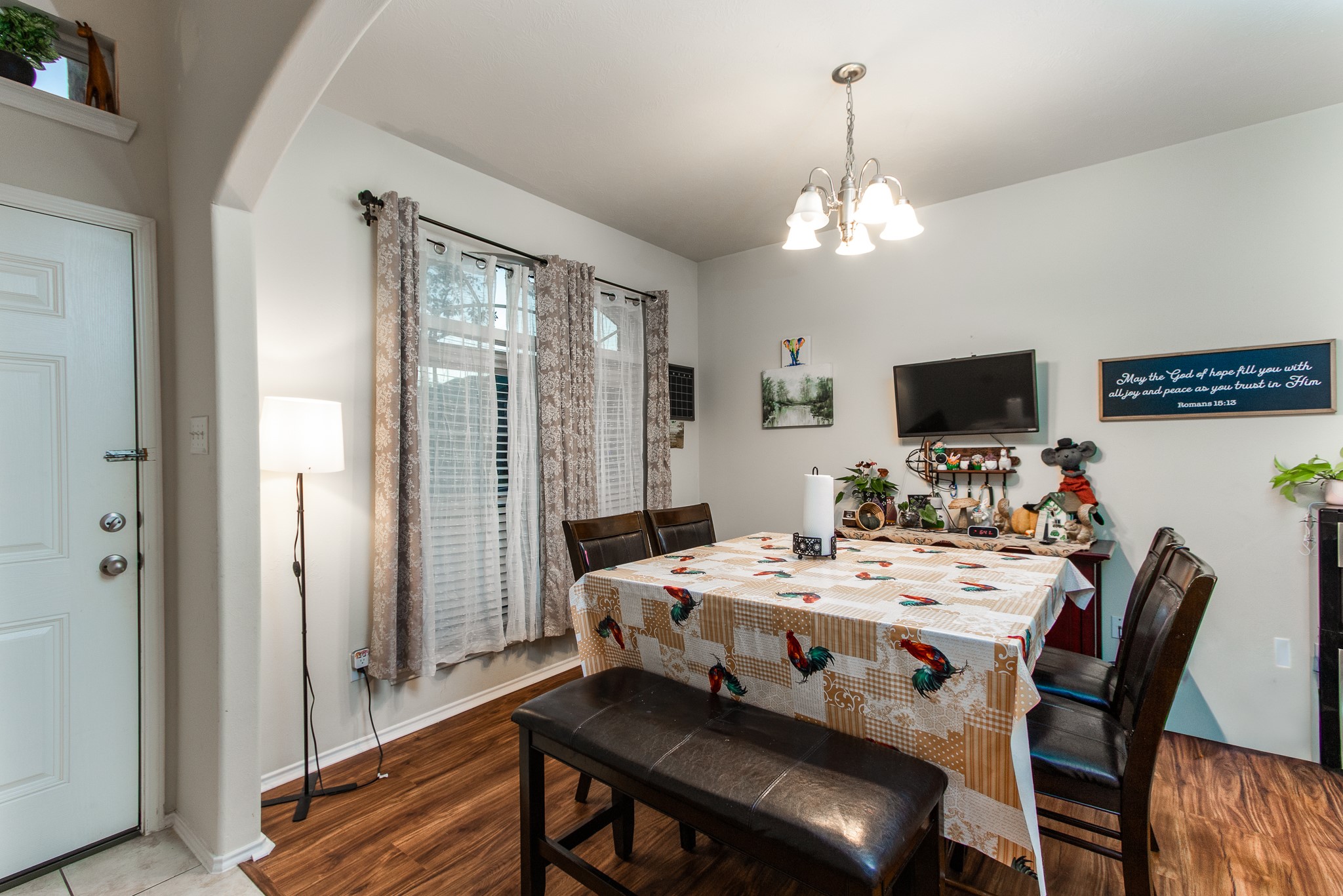 1107 Arum Road Missouri City, TX 77489 - Photo 7 of 23 a view of a dining room with furniture window and wooden floor
