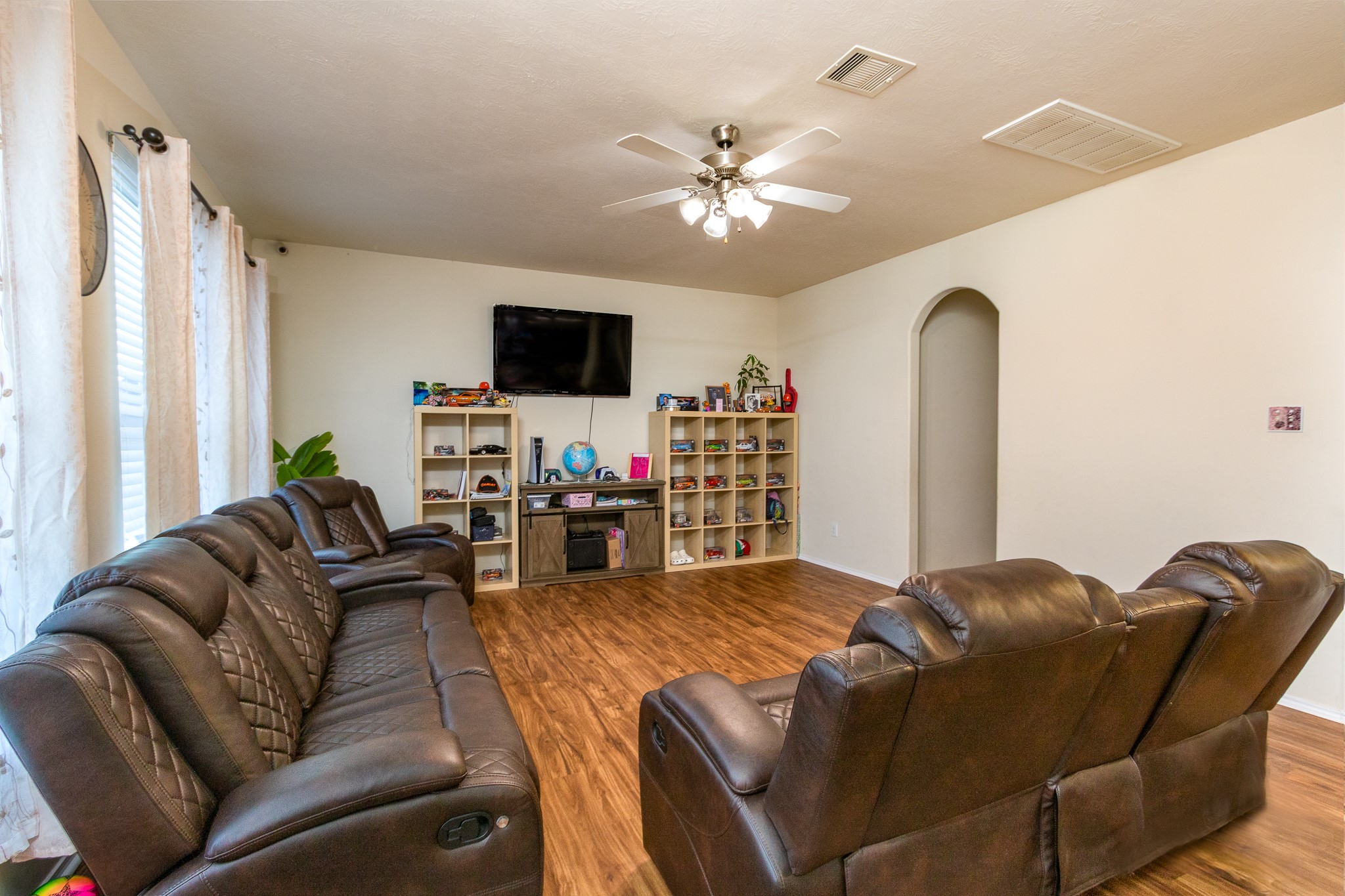 1107 Arum Road Missouri City, TX 77489 - Photo 10 of 23 a living room with furniture and a flat screen tv