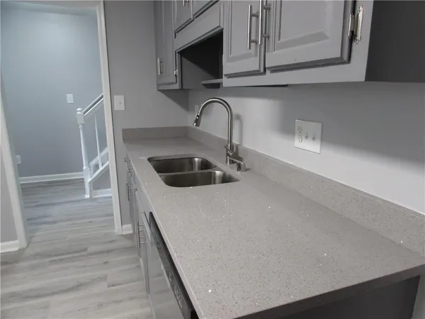 a stove top oven sitting inside of a kitchen