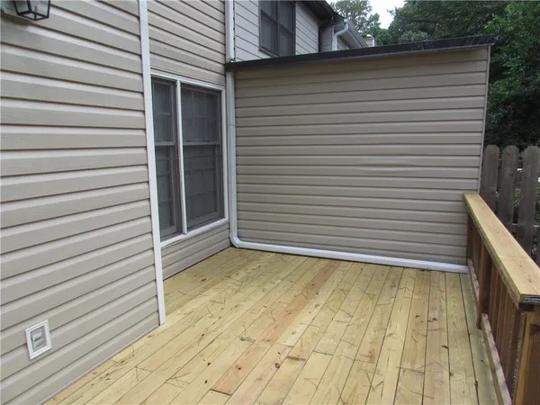a view of a room with wooden walls