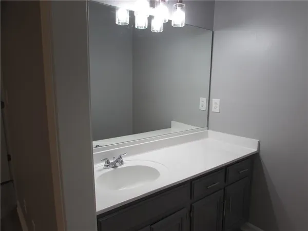 a white toilet sitting next to a bathtub