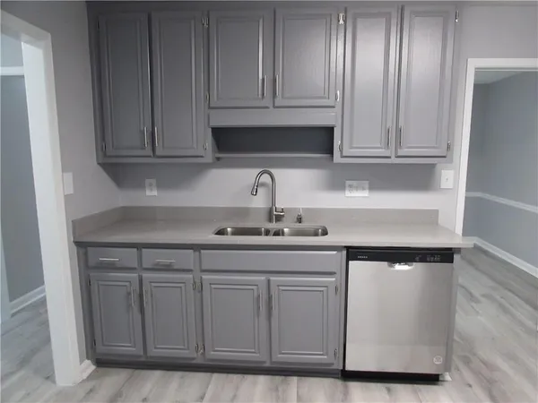 a kitchen with appliances and cabinets