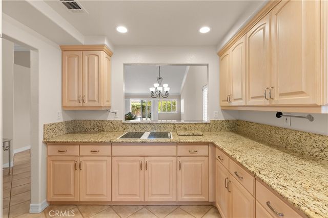a kitchen with sink cabinets and window