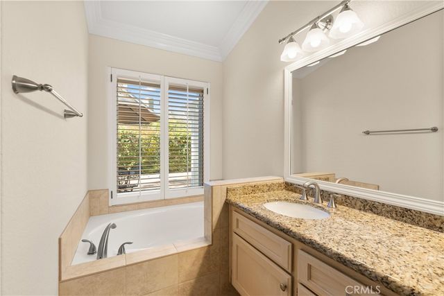 a bathroom with a shower and a sink