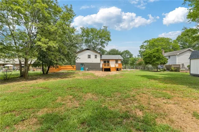 a view of a tree in front of a house