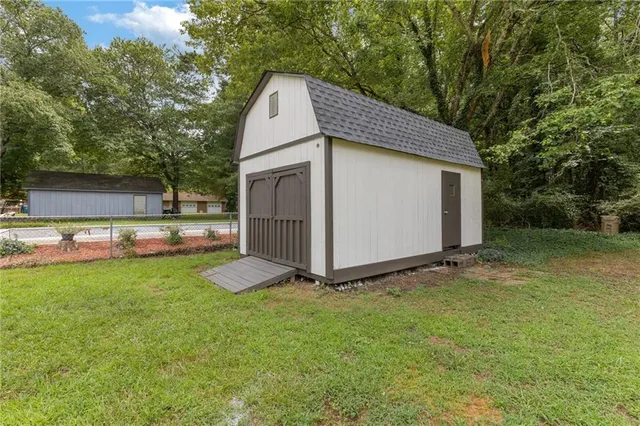 a view of an empty room and wooden shelves