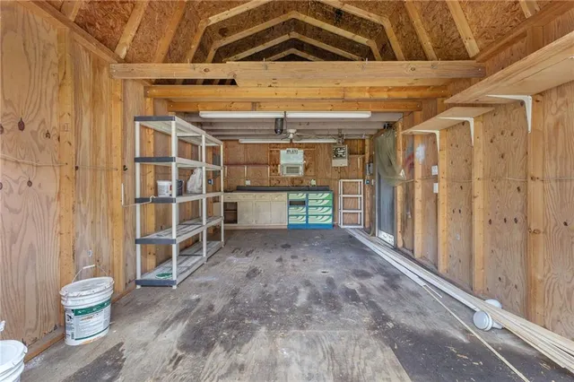 a picture of a bench in front of a wall