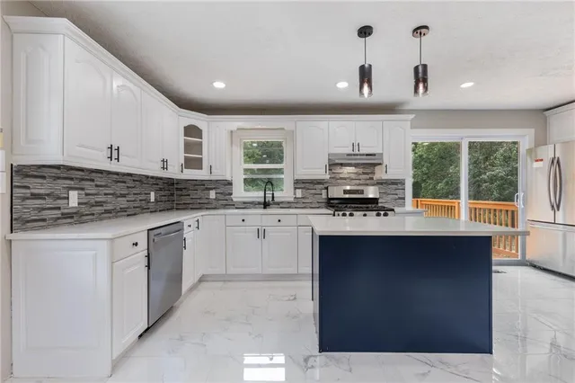 a view of a livingroom with a kitchen