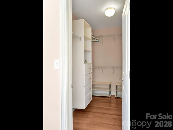 a view of a bathroom with a sink and a shower