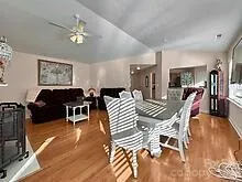 a view of a dining room with furniture and chandelier