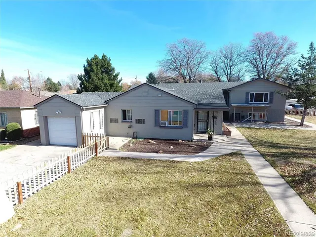 a house view with a sitting space and garden