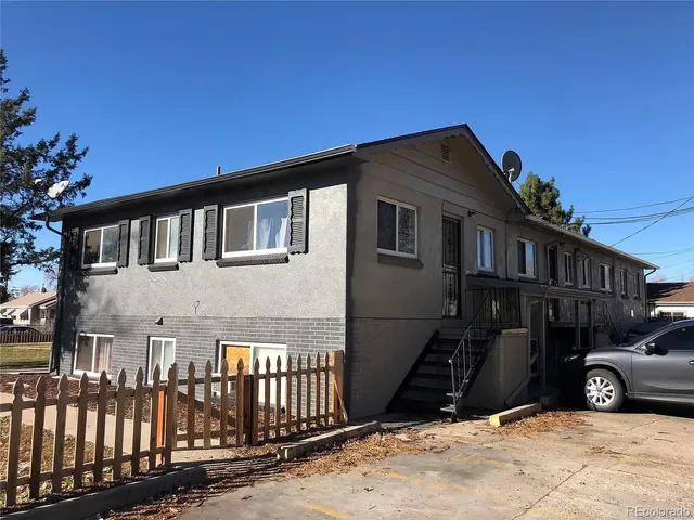 a view of a house with a snow in the yard