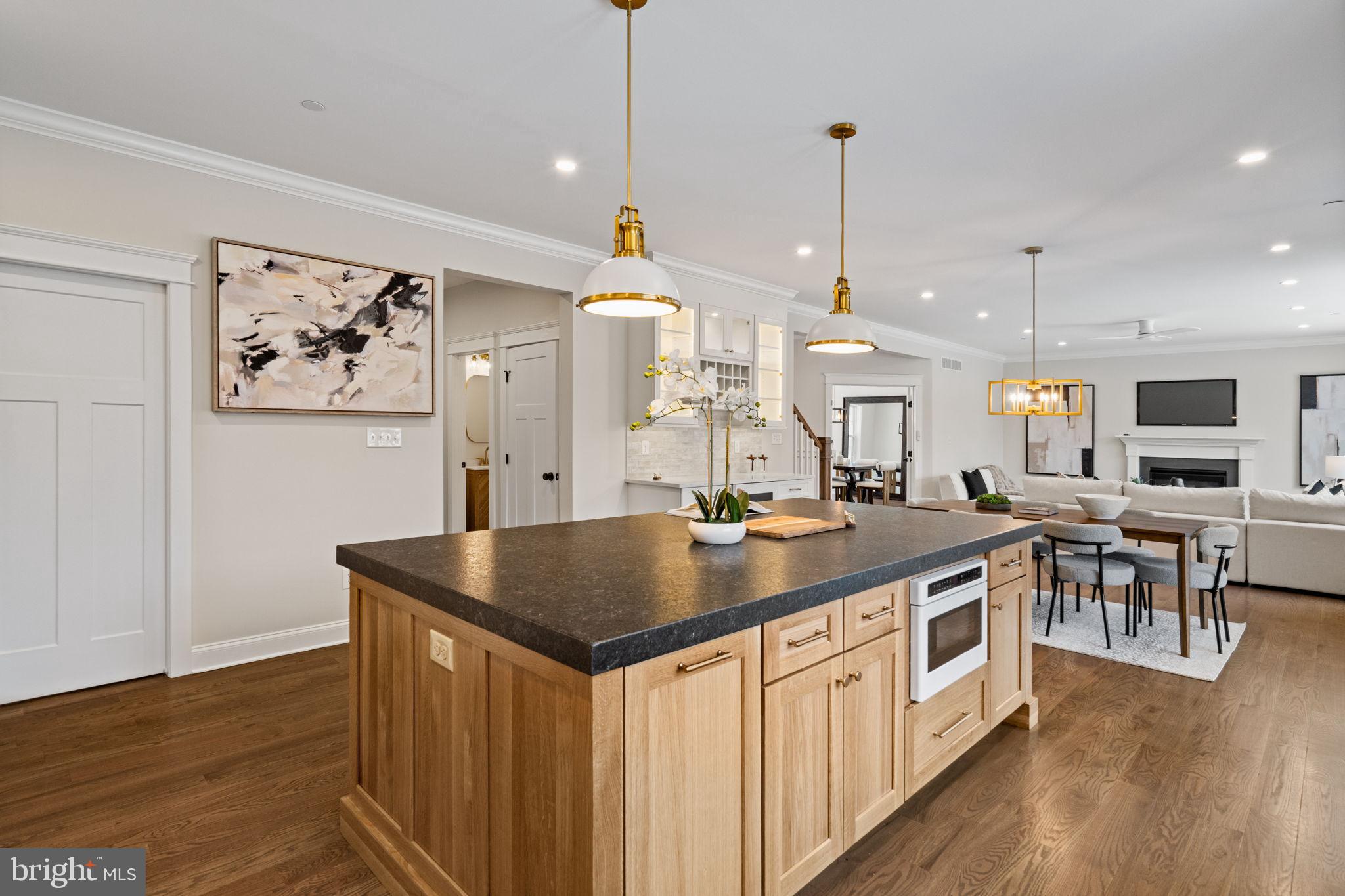 305 Glenway Road Glenside, PA 19038 - Photo 32 of 93 a kitchen with stainless steel appliances granite countertop a sink a stove and a wooden floors