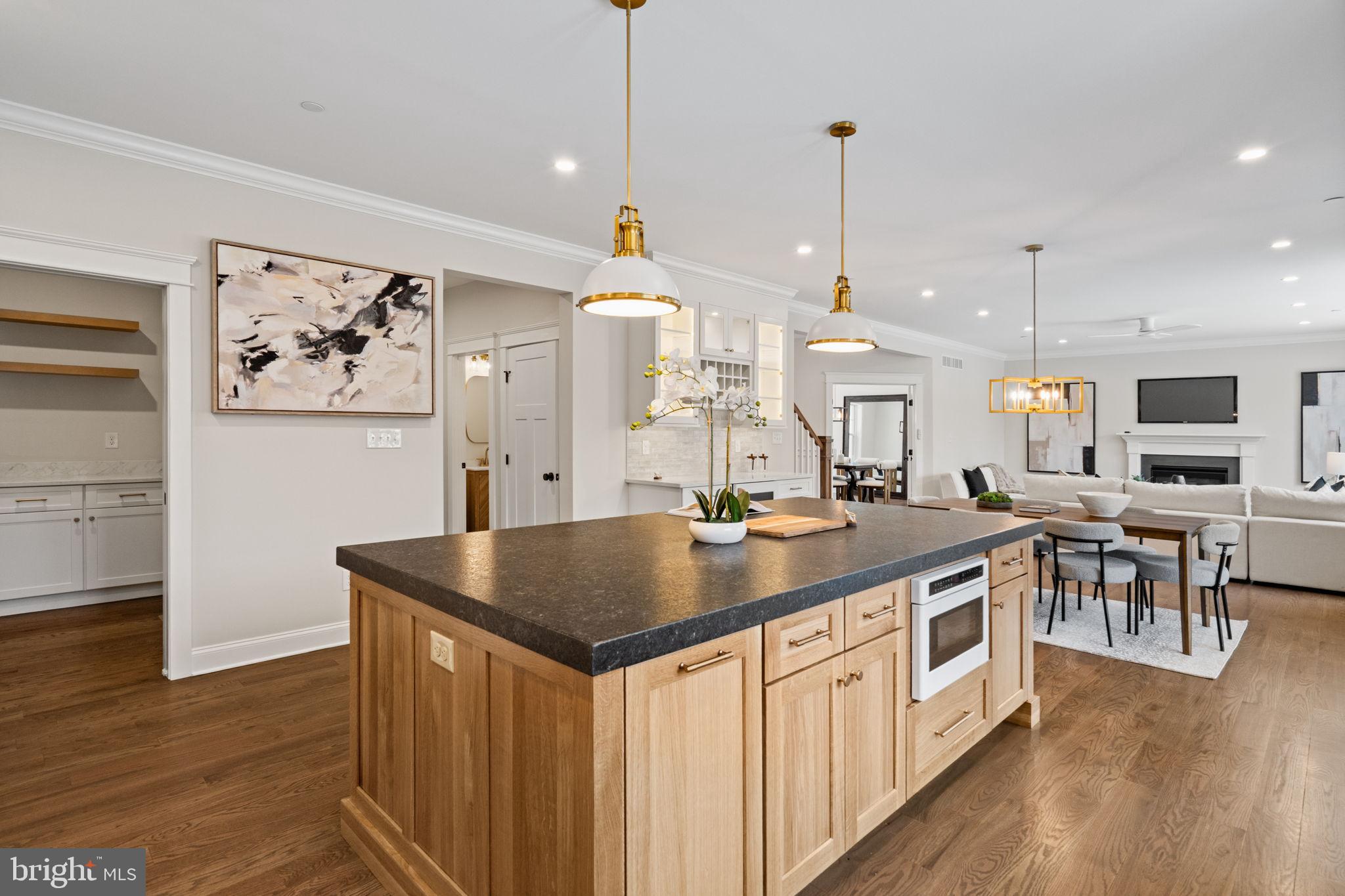 305 Glenway Road Glenside, PA 19038 - Photo 33 of 93 a kitchen with stainless steel appliances granite countertop a sink a stove and a wooden floors