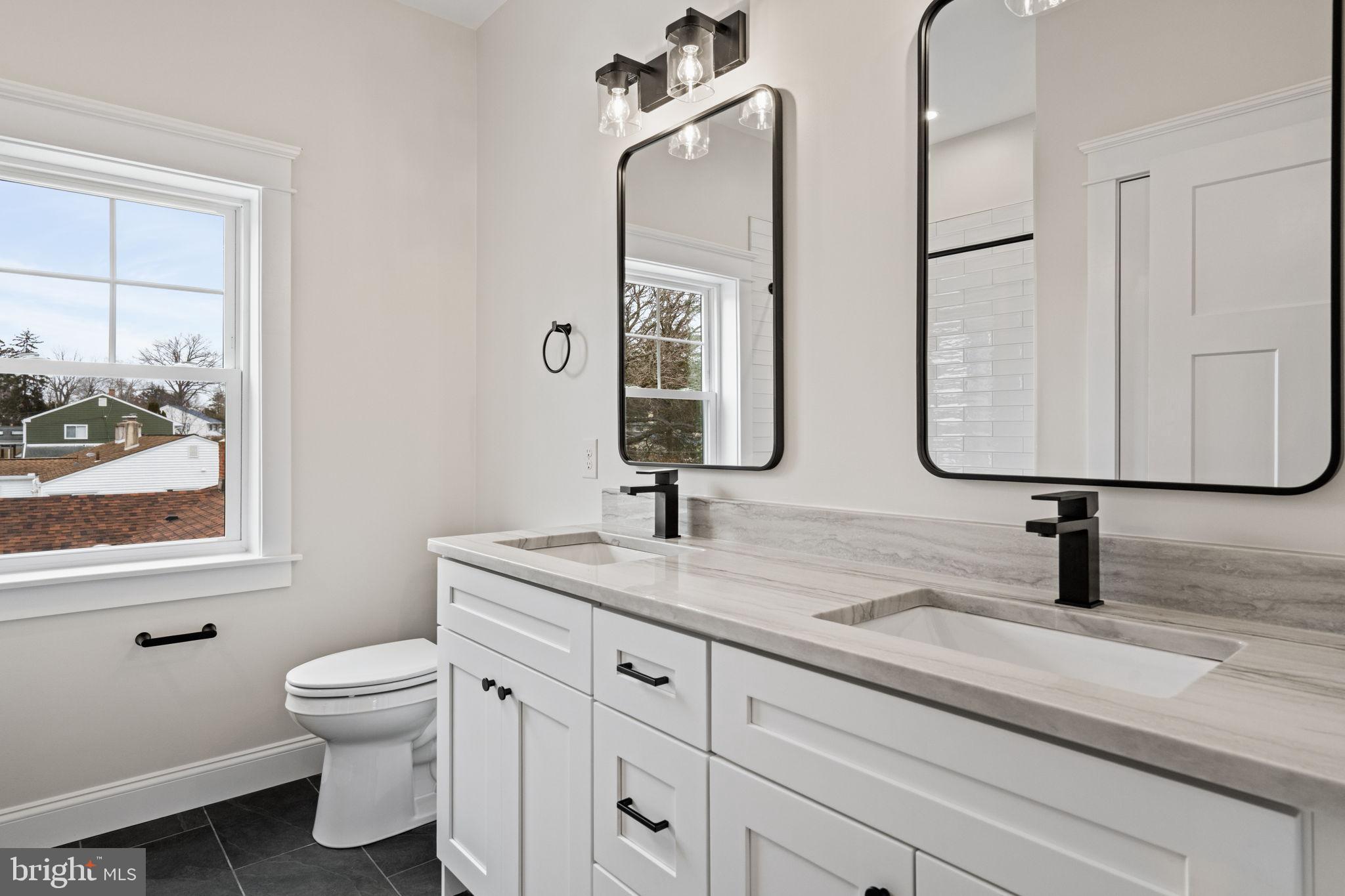 305 Glenway Road Glenside, PA 19038 - Photo 58 of 93 a bathroom with double vanity a toilet a and a window
