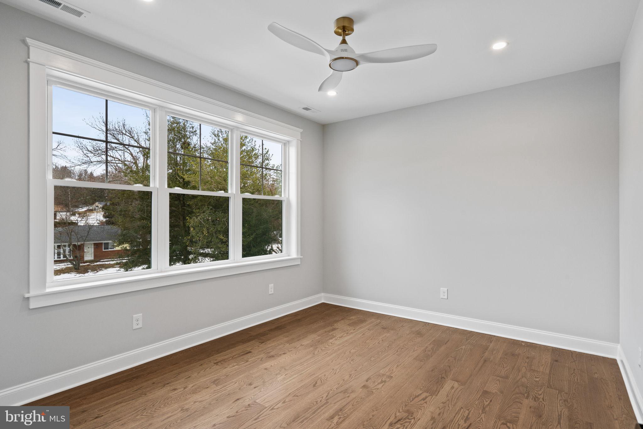 305 Glenway Road Glenside, PA 19038 - Photo 65 of 93 a view of an empty room with a window and wooden floor