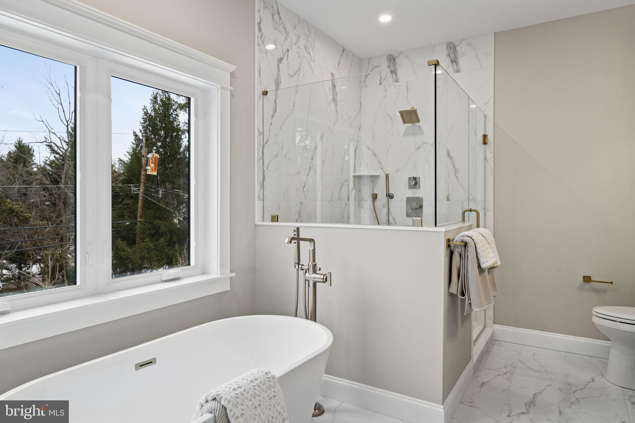 305 Glenway Road Glenside, PA 19038 - Photo 81 of 93 a bathroom with a tub a sink and a window