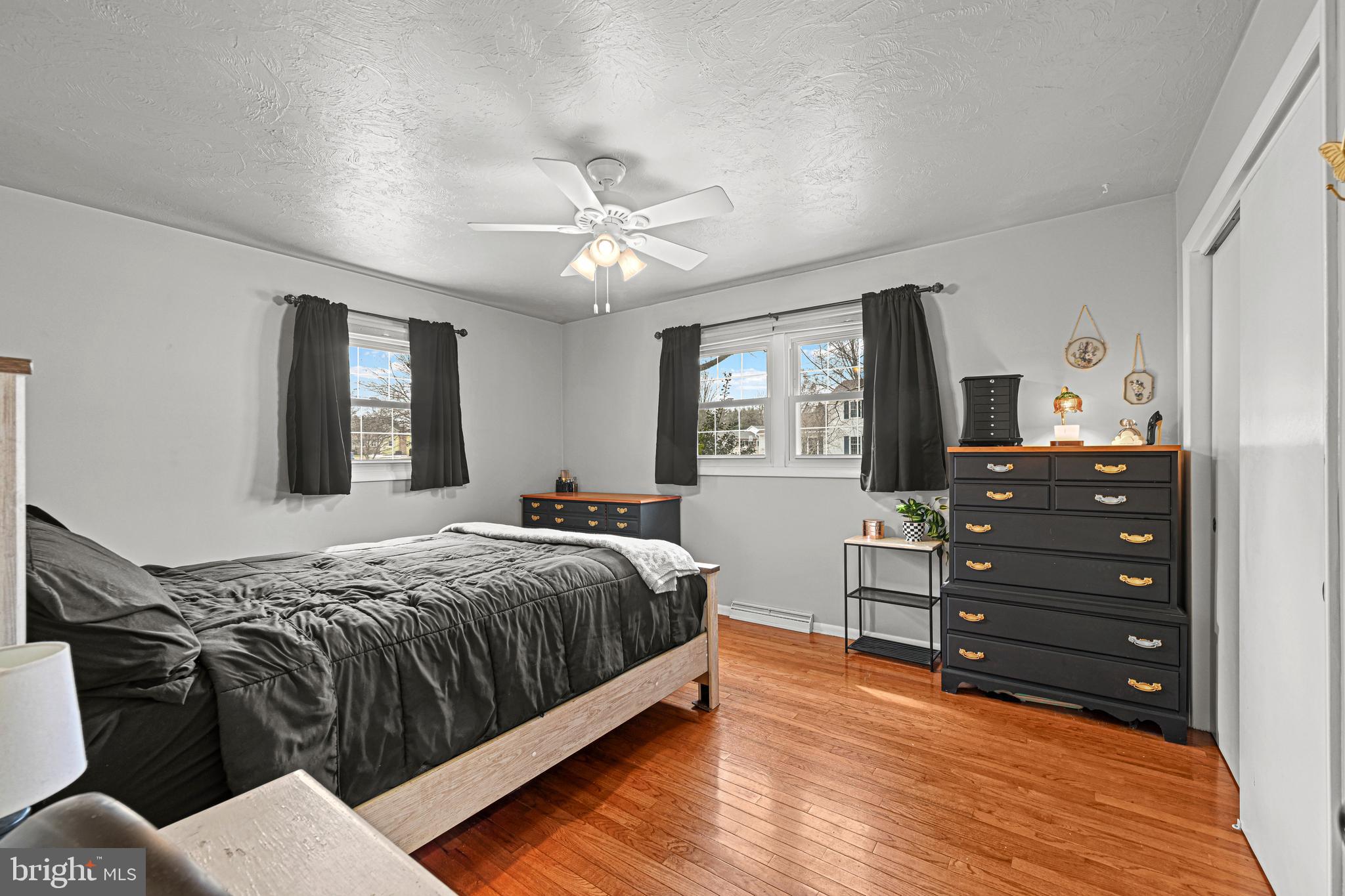 3541 Village Road Dover, PA 17315 - Photo 13 of 36 a bedroom with a bed and wooden floor