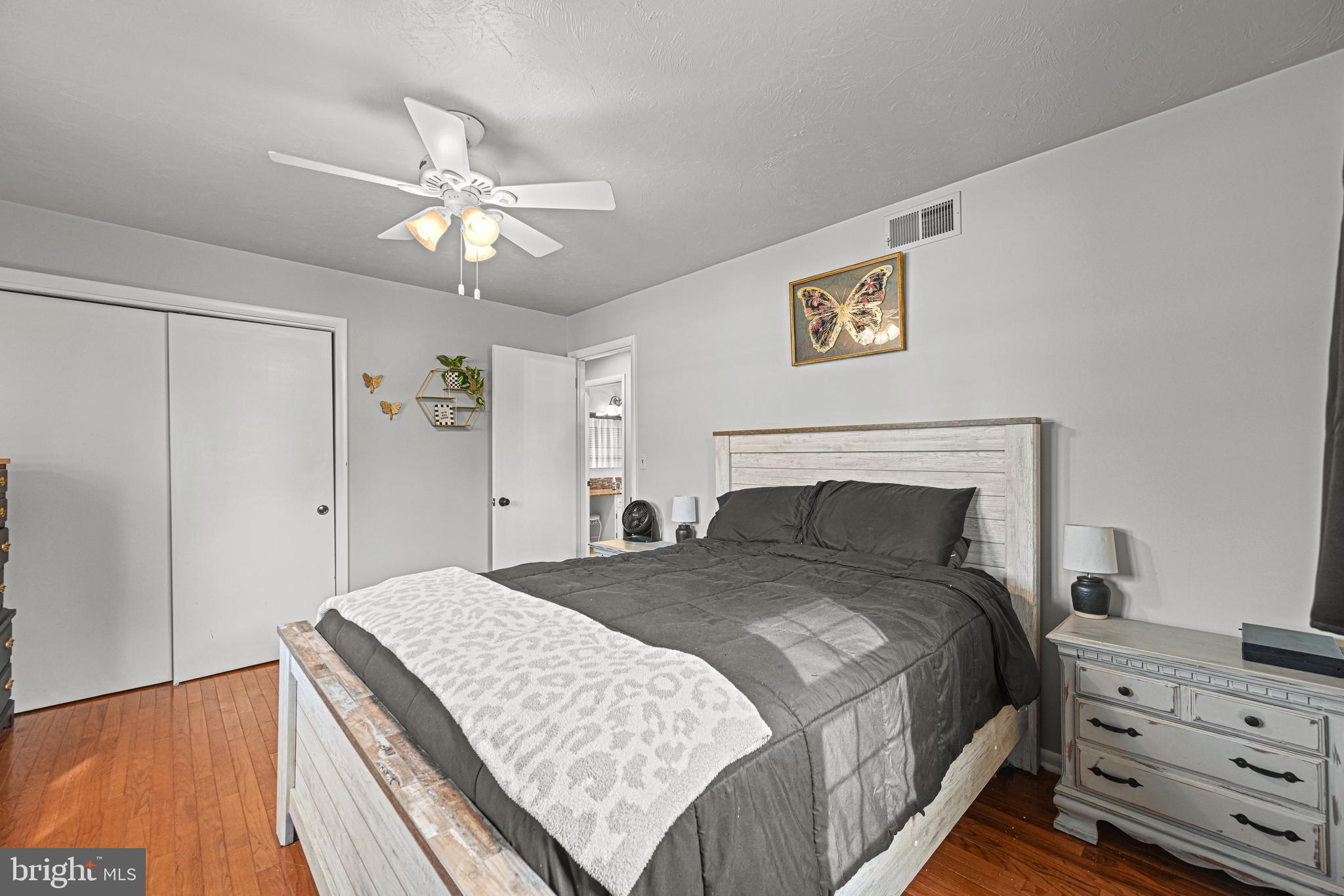 3541 Village Road Dover, PA 17315 - Photo 15 of 36 a bedroom with a bed and a chandelier