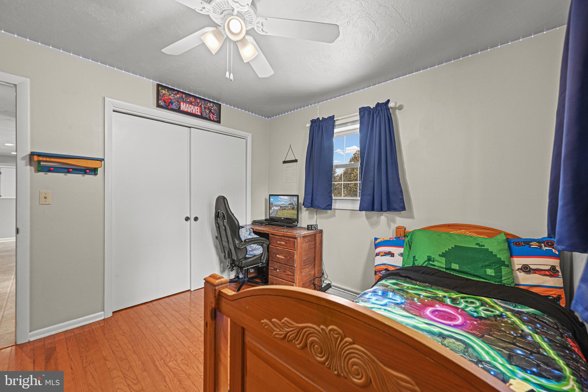 3541 Village Road Dover, PA 17315 - Photo 17 of 36 a bedroom with a bed and a chandelier