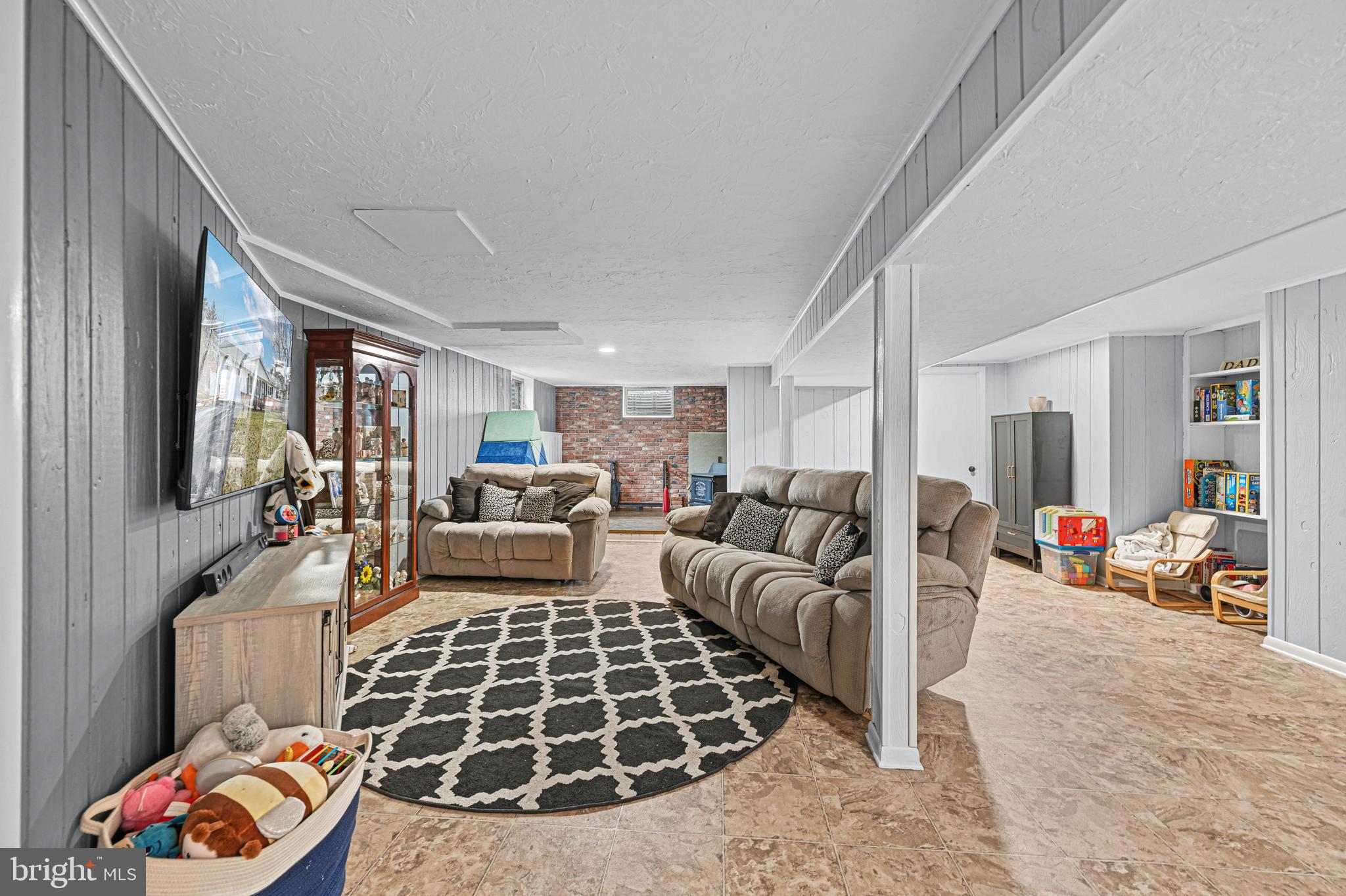 3541 Village Road Dover, PA 17315 - Photo 18 of 36 a living room with furniture and a flat screen tv