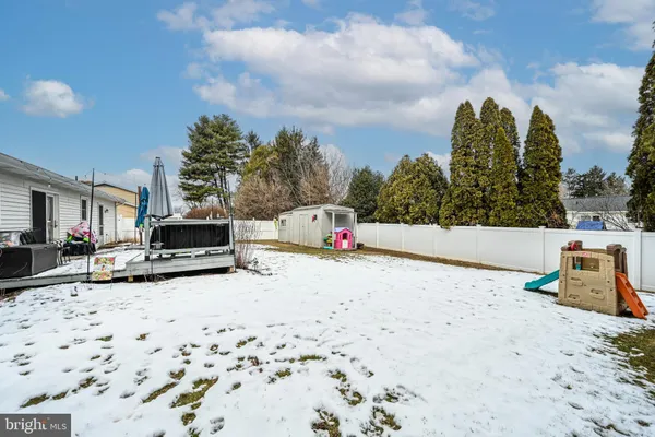a white house that has a tree in it